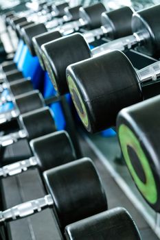 Close up image of Fitness equipment dumbbells weight,Gym background