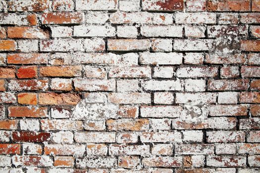 Old large red brick wall texture background distressed with white paint stock photo