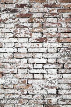 Old large red brick wall background distressed with white paint stock photo