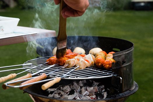 Grilled meat on a summer barbecue in the garden