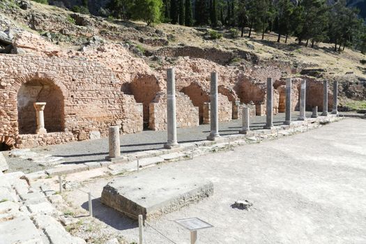 The ruins in Delphi, an archaeological site in Greece at the Mount Parnassus. Delphi is famous by the oracle at the sanctuary dedicated to Apollo. UNESCO World heritage