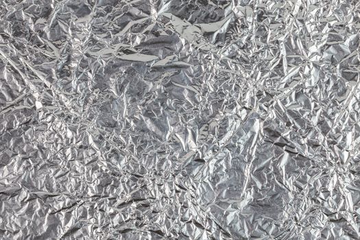 crumpled aluminium foil flat background and texture.