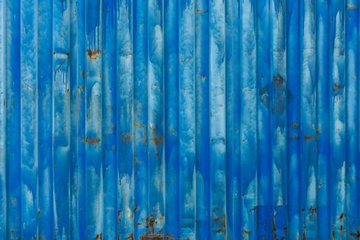 outside wall of old blue iso freight container - background and texture.