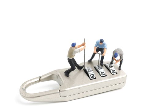 Miniature people worker  : Teamwork helps to unlock password on the keys. Team work concept.