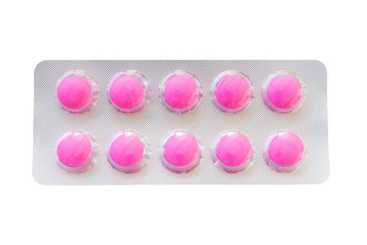 Pink pills in blister pack isolate on white with Clipping path