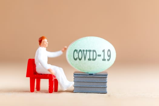 Miniature people , Doctor research and Development Coronavirus Vaccine , Medicine to stop outbreak Coronavirus COVID-19.
