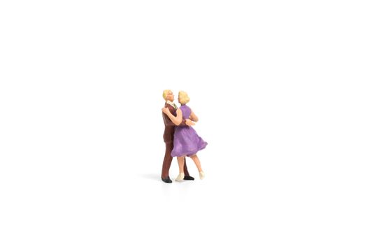 Miniature people, Couple romantic dancing on white background , Valentine's day concept