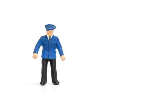 Miniature people : Policeman standing isolate on white background