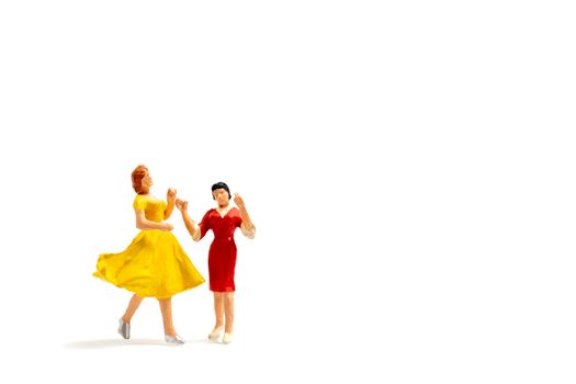 Miniature people Lesbian couple dancing on white background , Homosexual Relationship concept
