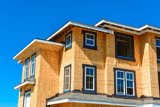 Brand new townhouses building under construction on sunny day in British Columbia, Canada.
