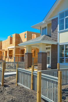 Front yard and entrance of brand new family townhouses on construction completion stage.