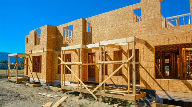 New family house is under construction on sunny day