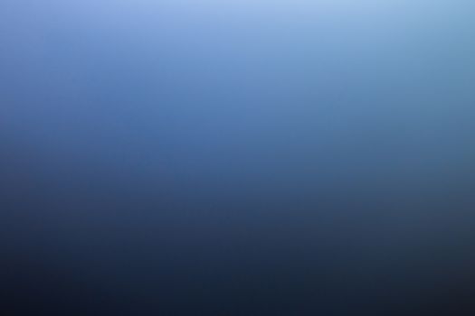 abstract black to blue gradient photographic blur background.