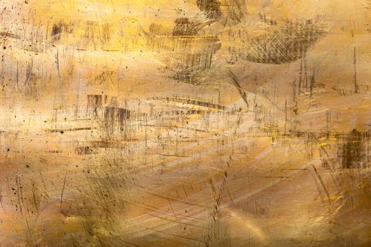 full frame scratched brass sheet texture and close-up background