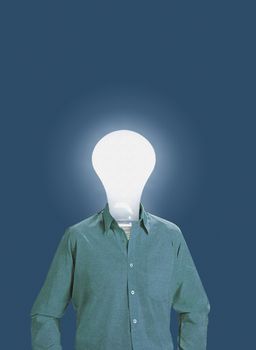 Glowing light bulb in man's shirt. Idea