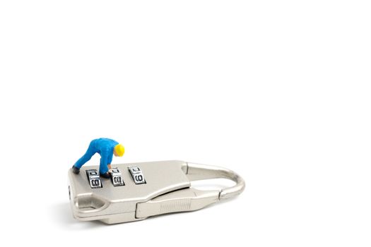 Miniature people worker  : Teamwork helps to unlock password on the keys. Team work concept.