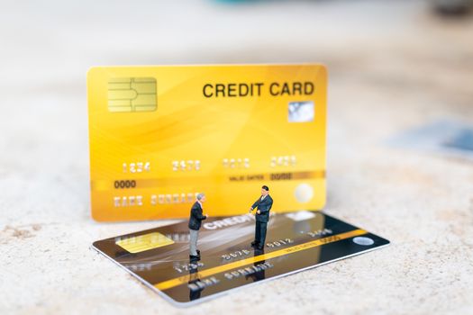 Miniature people : business people sianding on Credit card , Business and Finance concepts