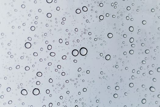 Raindrops on window glasses surface , Natural Pattern of raindrops.