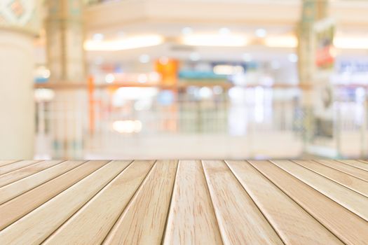 Wooden desk with colorful lighting blurred background