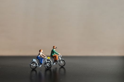 Miniature people : Travelers riding bicycle , Healthy lifestyle concept