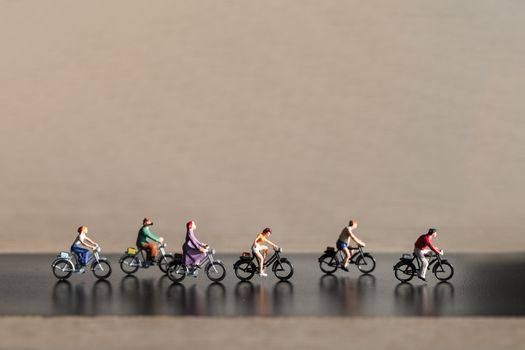 Miniature people : Travelers riding bicycle , Healthy lifestyle concept