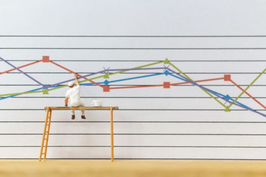 Miniature people : Worker painting business graph on white background , Business growth concept