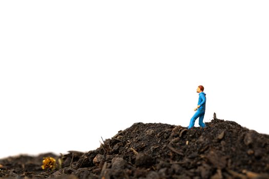 Miniature people : Man Running on The ground  isolated on white background , Run for health concept.