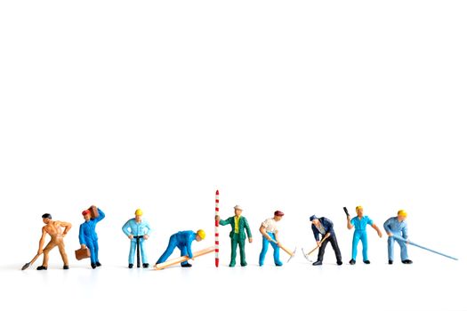 Miniature people ,worker team standing on white background and copy space for your text , Labour day concept