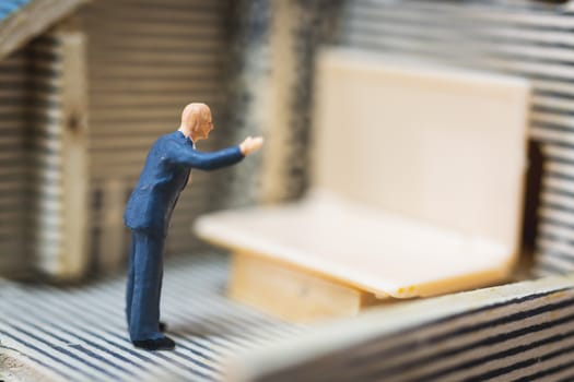 Miniature people business man working with computer labtop , Work at home concept