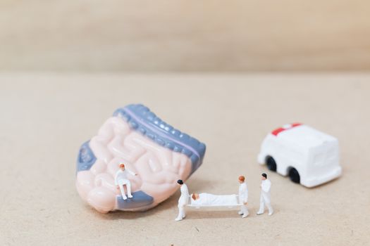 Miniature people ; doctor and nurse "team specialists" observing and discussing about human Intestine , Science and Medical Concept