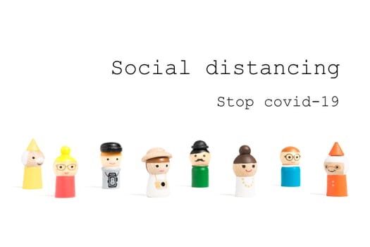 Stop COVID-19 Social distancing text with miniature people on white background. Social distancing concept