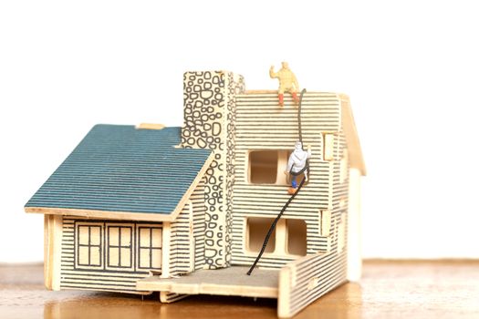 Miniature people stay at home doing self-quarantine , stay home concept