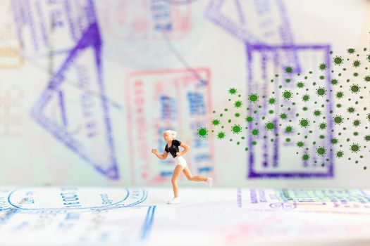 Miniature model  runs away from coronavirus 2019-ncov flu infection. Coronavirus helath crisis concept.