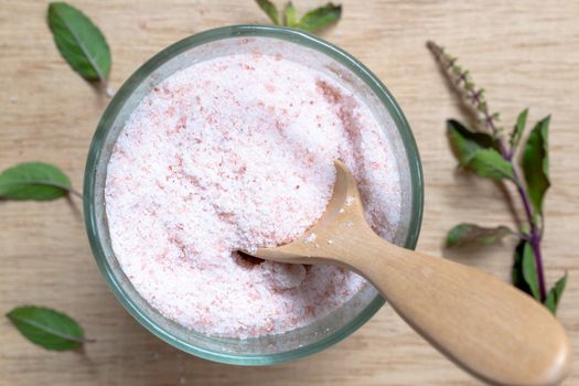 Pink salt , Himalayan salt on wooden background