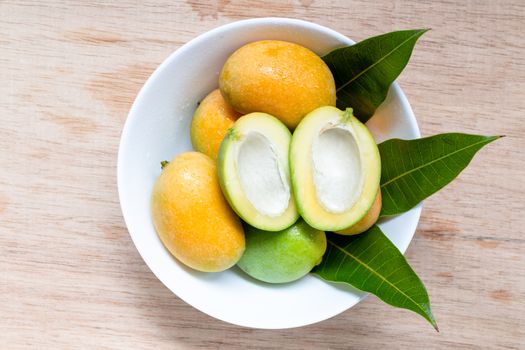 Close up Wild mango on wooden background