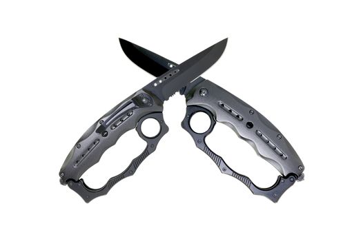 Military knife with brass knuckles isolated on white background 

