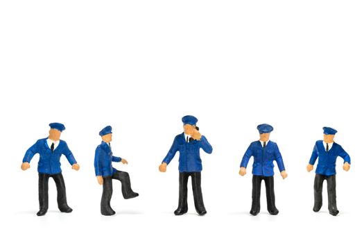 Miniature people : Policeman standing isolate on white background