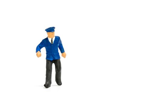 Miniature people : Policeman standing isolate on white background