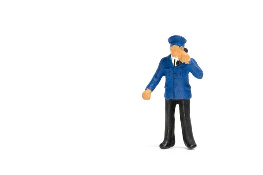 Miniature people : Policeman standing isolate on white background