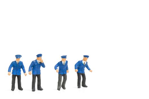 Miniature people : Policeman standing isolate on white background