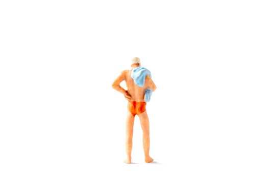 Miniature people wearing swimsuit  standing on white background , Summer time concept