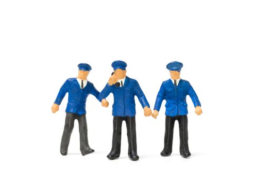 Miniature people : Policeman standing isolate on white background