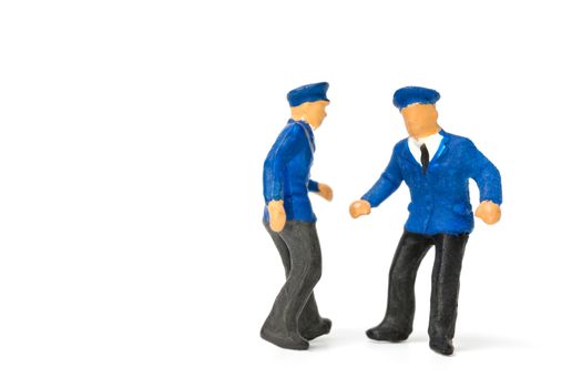 Miniature people : Policeman standing isolate on white background