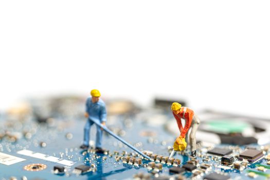 Miniature people working on cpu board, Technology concept