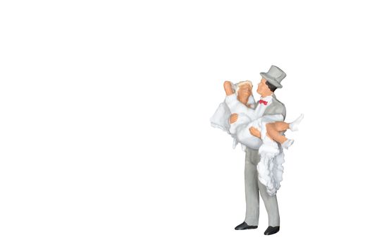 Miniature people : Wedding bride and groom isolated on white and clipping path