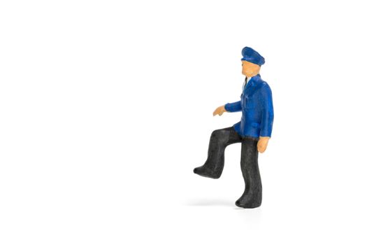 Miniature people : Policeman standing isolate on white background