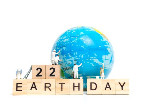 Miniature people : Painters painting on The globe on white background , Earth day concept