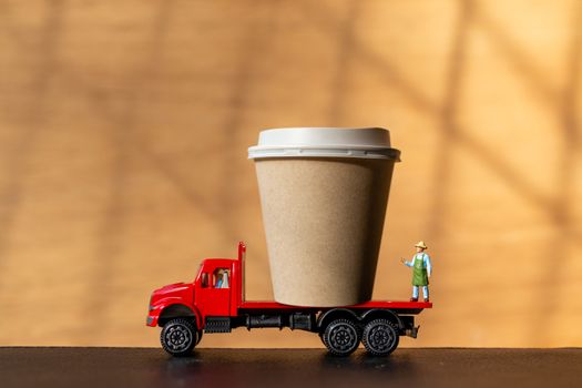 Miniature People and Coffee to-go Cup , Coffee delivery concept
