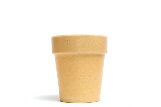 Recycled materials biodegradable tree pot isolated on a white background