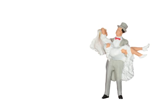 Miniature people : Wedding bride and groom isolated on white and clipping path